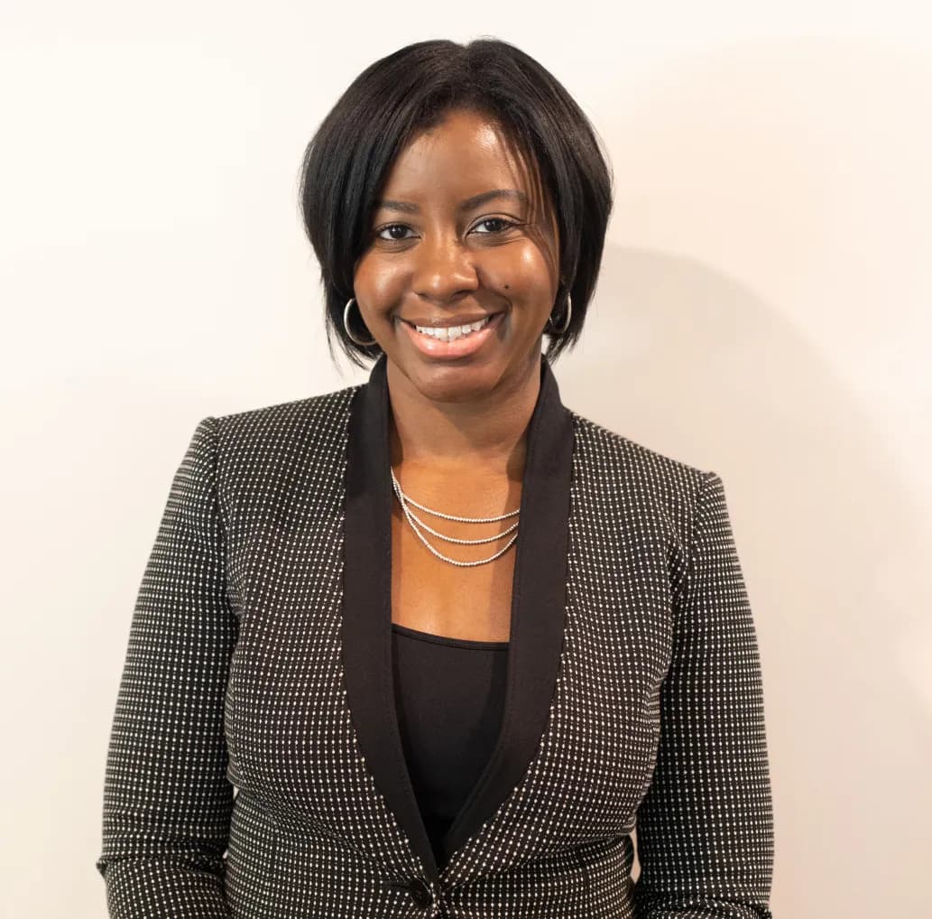 A professional headshot image of Andie Jenkins.