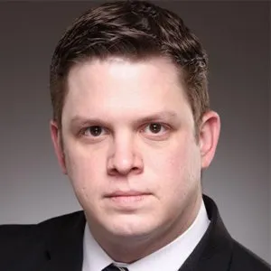 A professional headshot image of Grant Brim.