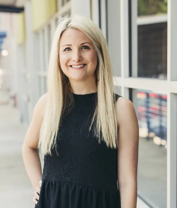 A professional headshot of Emily Moody.