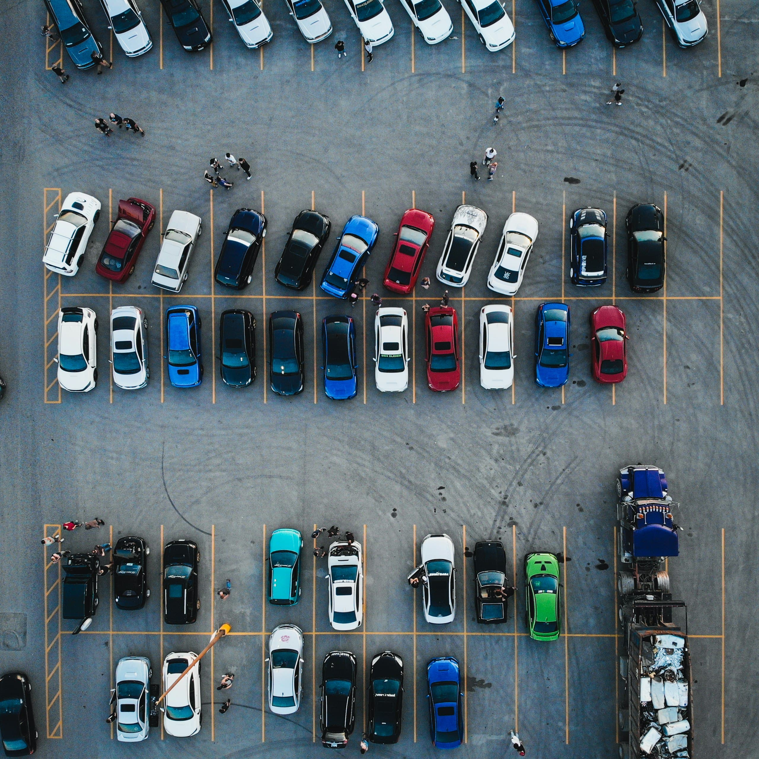 Top-down drone shot of a car meetby Brydon McCluskey